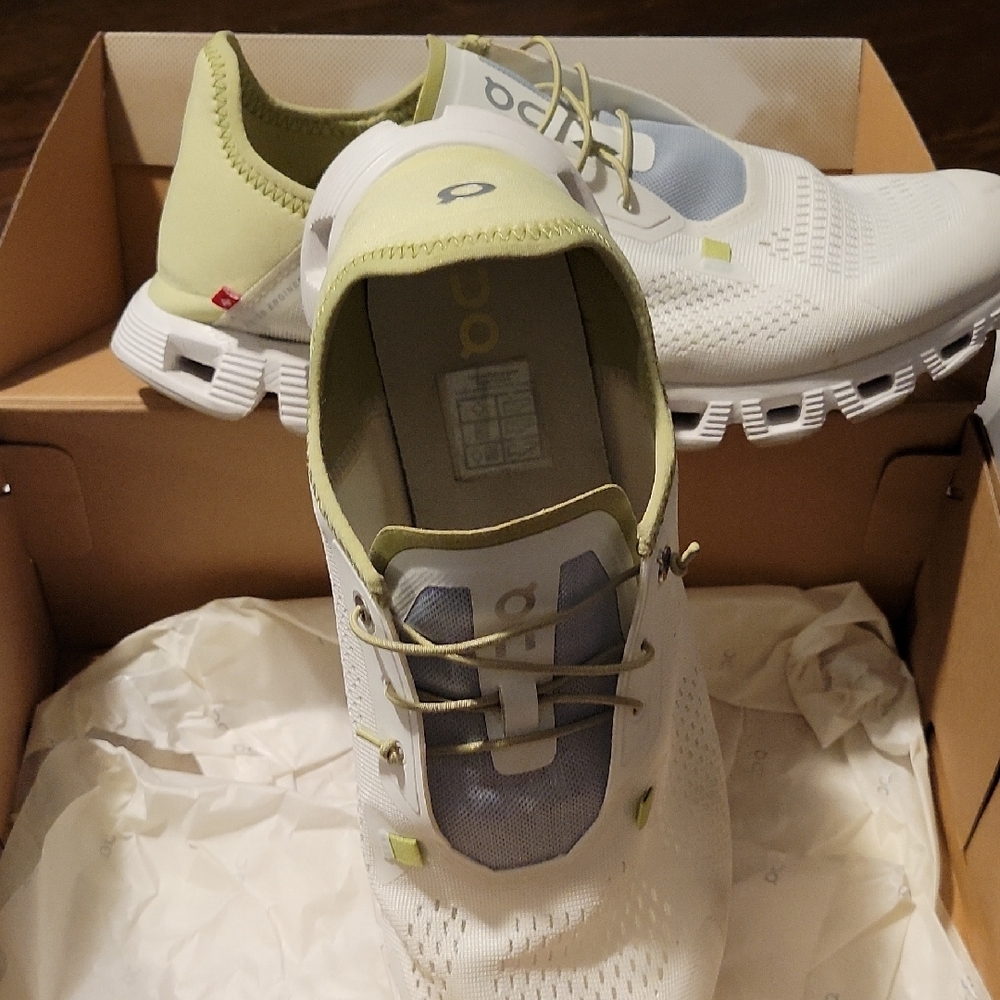 On Running White and Light Green Athletic Shoes